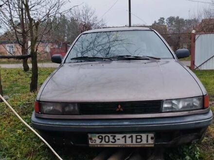 Коричневый Мицубиси Лансер, объемом двигателя 1.5 л и пробегом 200 тыс. км за 700 $, фото 1 на Automoto.ua
