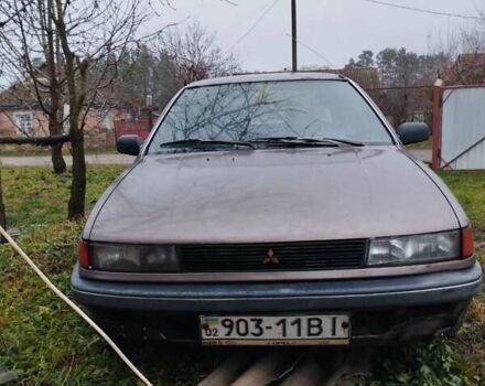 Коричневый Мицубиси Лансер, объемом двигателя 1.5 л и пробегом 200 тыс. км за 700 $, фото 1 на Automoto.ua