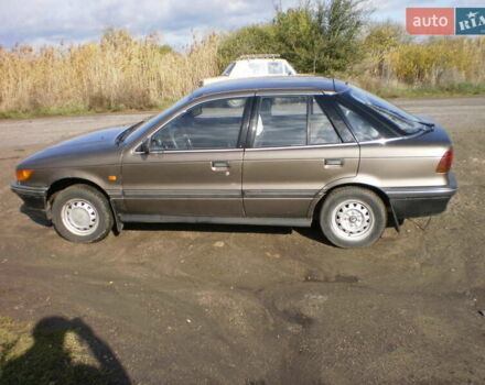 Коричневый Мицубиси Лансер, объемом двигателя 1.5 л и пробегом 220 тыс. км за 1800 $, фото 1 на Automoto.ua