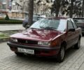 Красный Мицубиси Лансер, объемом двигателя 1.5 л и пробегом 270 тыс. км за 950 $, фото 1 на Automoto.ua