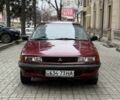 Красный Мицубиси Лансер, объемом двигателя 1.5 л и пробегом 270 тыс. км за 950 $, фото 1 на Automoto.ua