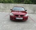 Червоний Міцубісі Lancer, об'ємом двигуна 1.3 л та пробігом 310 тис. км за 3300 $, фото 1 на Automoto.ua