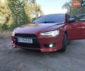 Червоний Міцубісі Lancer, об'ємом двигуна 2 л та пробігом 168 тис. км за 6800 $, фото 1 на Automoto.ua