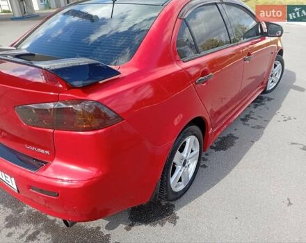 Червоний Міцубісі Lancer, об'ємом двигуна 2 л та пробігом 168 тис. км за 6800 $, фото 14 на Automoto.ua