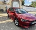 Красный Мицубиси Лансер, объемом двигателя 1.8 л и пробегом 186 тыс. км за 7300 $, фото 1 на Automoto.ua
