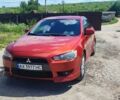 Красный Мицубиси Лансер, объемом двигателя 1.8 л и пробегом 256 тыс. км за 7100 $, фото 1 на Automoto.ua