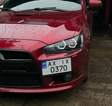 Красный Мицубиси Лансер, объемом двигателя 2 л и пробегом 128 тыс. км за 14700 $, фото 11 на Automoto.ua