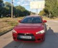 Красный Мицубиси Лансер, объемом двигателя 1.8 л и пробегом 221 тыс. км за 7500 $, фото 1 на Automoto.ua