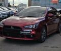 Красный Мицубиси Лансер, объемом двигателя 2 л и пробегом 129 тыс. км за 12890 $, фото 1 на Automoto.ua