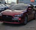 Красный Мицубиси Лансер, объемом двигателя 2 л и пробегом 129 тыс. км за 13800 $, фото 1 на Automoto.ua