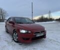 Красный Мицубиси Лансер, объемом двигателя 2 л и пробегом 320 тыс. км за 6300 $, фото 1 на Automoto.ua