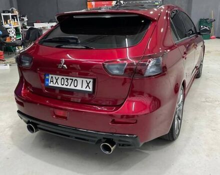 Красный Мицубиси Лансер, объемом двигателя 2 л и пробегом 128 тыс. км за 14700 $, фото 5 на Automoto.ua