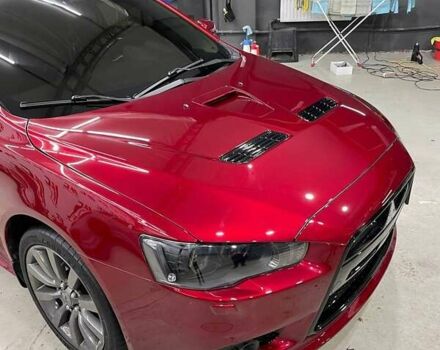 Красный Мицубиси Лансер, объемом двигателя 2 л и пробегом 128 тыс. км за 14700 $, фото 3 на Automoto.ua