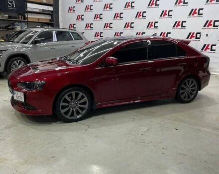 Красный Мицубиси Лансер, объемом двигателя 2 л и пробегом 128 тыс. км за 14700 $, фото 1 на Automoto.ua