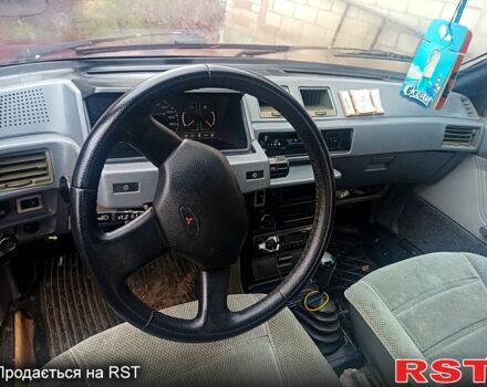 Красный Мицубиси Лансер, объемом двигателя 1.5 л и пробегом 310 тыс. км за 600 $, фото 1 на Automoto.ua