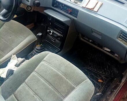 Красный Мицубиси Лансер, объемом двигателя 1.5 л и пробегом 310 тыс. км за 600 $, фото 2 на Automoto.ua