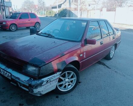 Красный Мицубиси Лансер, объемом двигателя 1.5 л и пробегом 222 тыс. км за 700 $, фото 1 на Automoto.ua