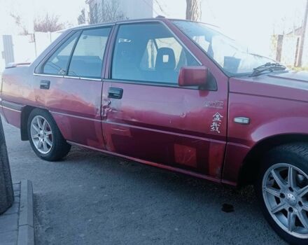 Красный Мицубиси Лансер, объемом двигателя 1.5 л и пробегом 222 тыс. км за 700 $, фото 2 на Automoto.ua