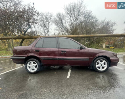 Красный Мицубиси Лансер, объемом двигателя 1.2 л и пробегом 220 тыс. км за 1300 $, фото 1 на Automoto.ua