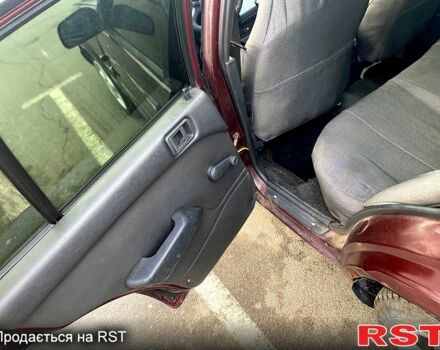 Красный Мицубиси Лансер, объемом двигателя 1.2 л и пробегом 420 тыс. км за 1900 $, фото 9 на Automoto.ua