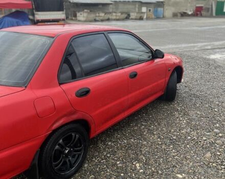 Червоний Міцубісі Lancer, об'ємом двигуна 1.3 л та пробігом 390 тис. км за 1500 $, фото 3 на Automoto.ua