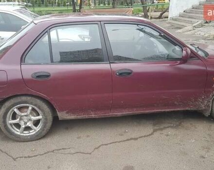 Красный Мицубиси Лансер, объемом двигателя 1.6 л и пробегом 362 тыс. км за 1700 $, фото 3 на Automoto.ua