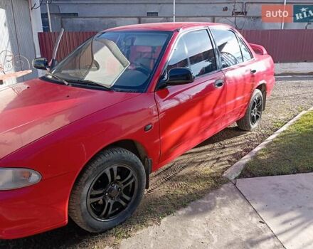 Червоний Міцубісі Lancer, об'ємом двигуна 1.3 л та пробігом 100 тис. км за 1200 $, фото 4 на Automoto.ua