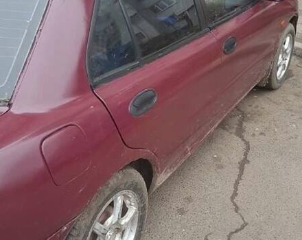 Красный Мицубиси Лансер, объемом двигателя 1.6 л и пробегом 362 тыс. км за 1700 $, фото 2 на Automoto.ua