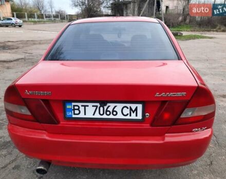 Красный Мицубиси Лансер, объемом двигателя 1.3 л и пробегом 409 тыс. км за 2000 $, фото 3 на Automoto.ua