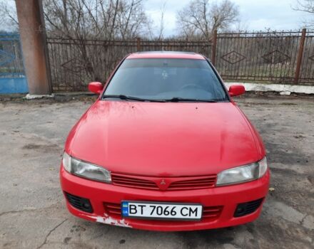 Красный Мицубиси Лансер, объемом двигателя 1.3 л и пробегом 409 тыс. км за 2000 $, фото 2 на Automoto.ua