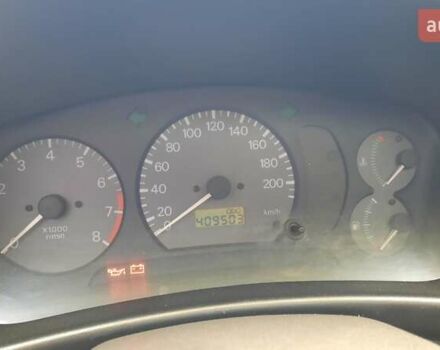 Красный Мицубиси Лансер, объемом двигателя 1.3 л и пробегом 409 тыс. км за 2000 $, фото 14 на Automoto.ua