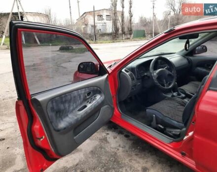 Красный Мицубиси Лансер, объемом двигателя 1.3 л и пробегом 409 тыс. км за 2000 $, фото 7 на Automoto.ua