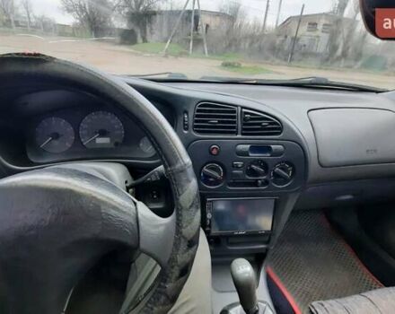 Красный Мицубиси Лансер, объемом двигателя 1.3 л и пробегом 409 тыс. км за 2000 $, фото 13 на Automoto.ua