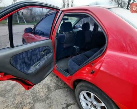 Красный Мицубиси Лансер, объемом двигателя 1.3 л и пробегом 409 тыс. км за 2000 $, фото 10 на Automoto.ua