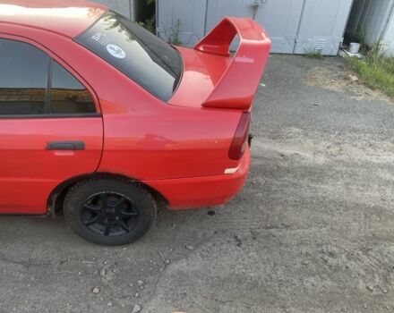 Красный Мицубиси Лансер, объемом двигателя 1.3 л и пробегом 330 тыс. км за 1200 $, фото 5 на Automoto.ua