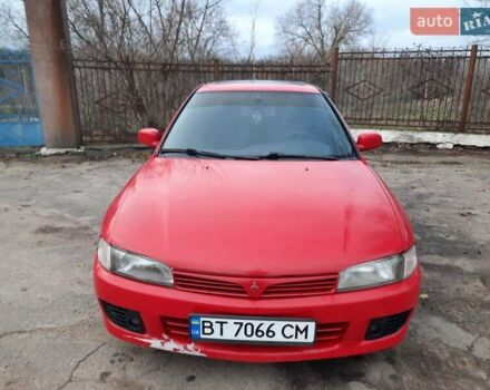 Красный Мицубиси Лансер, объемом двигателя 1.3 л и пробегом 409 тыс. км за 2000 $, фото 5 на Automoto.ua