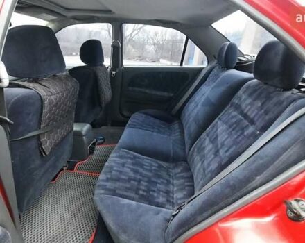 Красный Мицубиси Лансер, объемом двигателя 1.3 л и пробегом 409 тыс. км за 2000 $, фото 11 на Automoto.ua