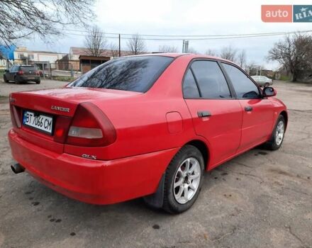 Красный Мицубиси Лансер, объемом двигателя 1.3 л и пробегом 409 тыс. км за 2000 $, фото 2 на Automoto.ua