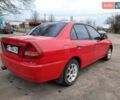 Красный Мицубиси Лансер, объемом двигателя 1.3 л и пробегом 409 тыс. км за 2000 $, фото 2 на Automoto.ua