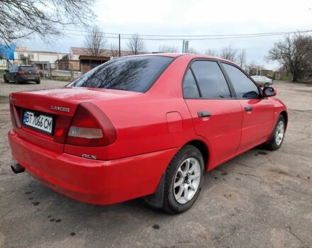 Красный Мицубиси Лансер, объемом двигателя 1.3 л и пробегом 409 тыс. км за 2000 $, фото 3 на Automoto.ua