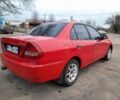 Красный Мицубиси Лансер, объемом двигателя 1.3 л и пробегом 409 тыс. км за 2000 $, фото 3 на Automoto.ua
