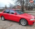 Красный Мицубиси Лансер, объемом двигателя 1.3 л и пробегом 409 тыс. км за 2000 $, фото 1 на Automoto.ua