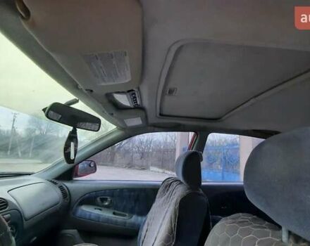 Красный Мицубиси Лансер, объемом двигателя 1.3 л и пробегом 409 тыс. км за 2000 $, фото 9 на Automoto.ua