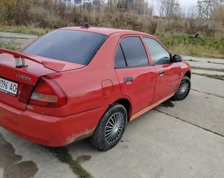 Червоний Міцубісі Lancer, об'ємом двигуна 1.3 л та пробігом 290 тис. км за 750 $, фото 4 на Automoto.ua