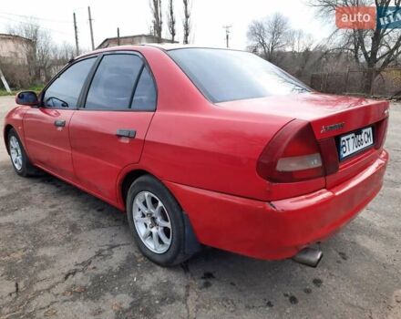 Красный Мицубиси Лансер, объемом двигателя 1.3 л и пробегом 409 тыс. км за 2000 $, фото 4 на Automoto.ua