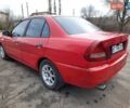 Красный Мицубиси Лансер, объемом двигателя 1.3 л и пробегом 409 тыс. км за 2000 $, фото 4 на Automoto.ua