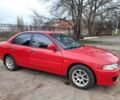 Красный Мицубиси Лансер, объемом двигателя 1.3 л и пробегом 409 тыс. км за 2000 $, фото 1 на Automoto.ua