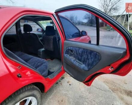 Красный Мицубиси Лансер, объемом двигателя 1.3 л и пробегом 409 тыс. км за 2000 $, фото 12 на Automoto.ua