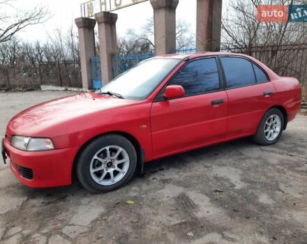 Красный Мицубиси Лансер, объемом двигателя 1.3 л и пробегом 409 тыс. км за 2000 $, фото 1 на Automoto.ua