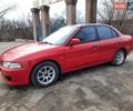 Красный Мицубиси Лансер, объемом двигателя 1.3 л и пробегом 409 тыс. км за 2000 $, фото 1 на Automoto.ua